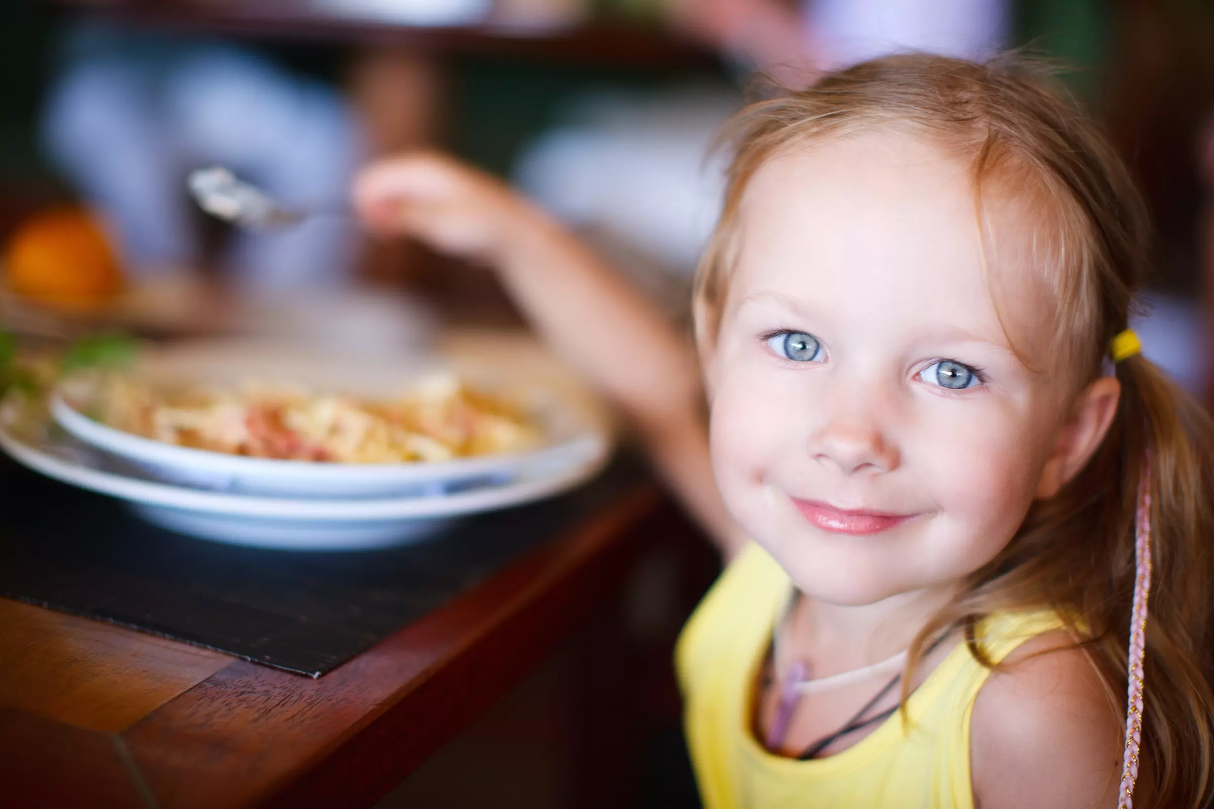 young girl eating at The Peddler