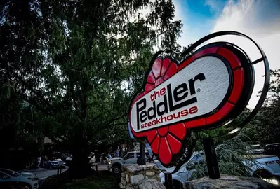 The Peddler sign and tree